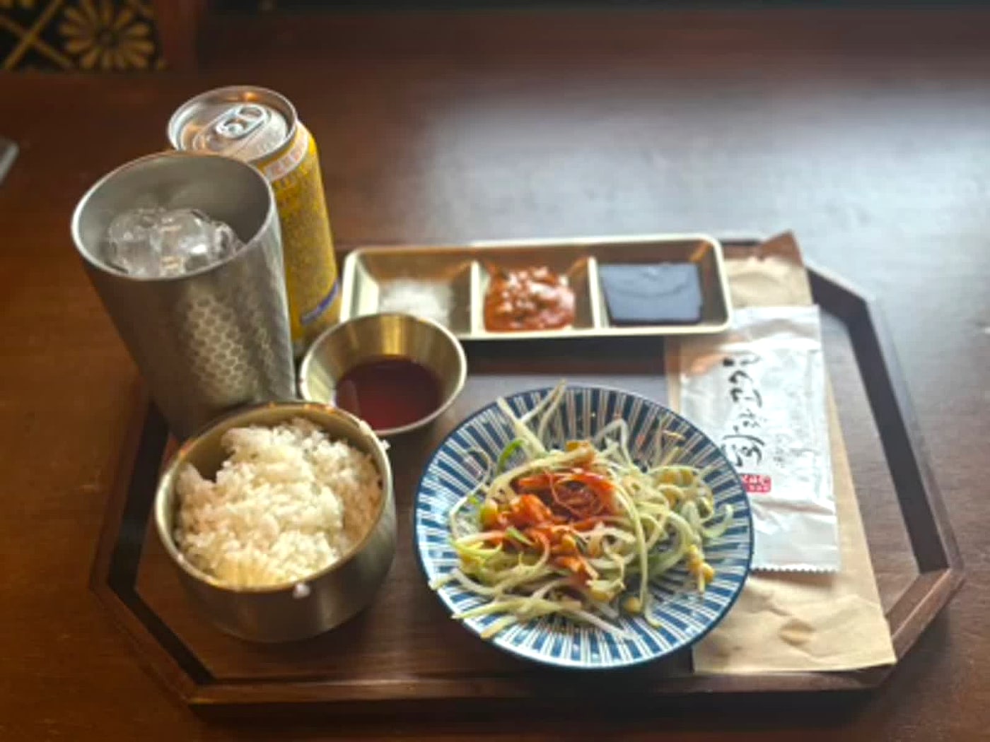 Rice, salad, sauces, and table setting from a Korean barbecue meal in Hongdae