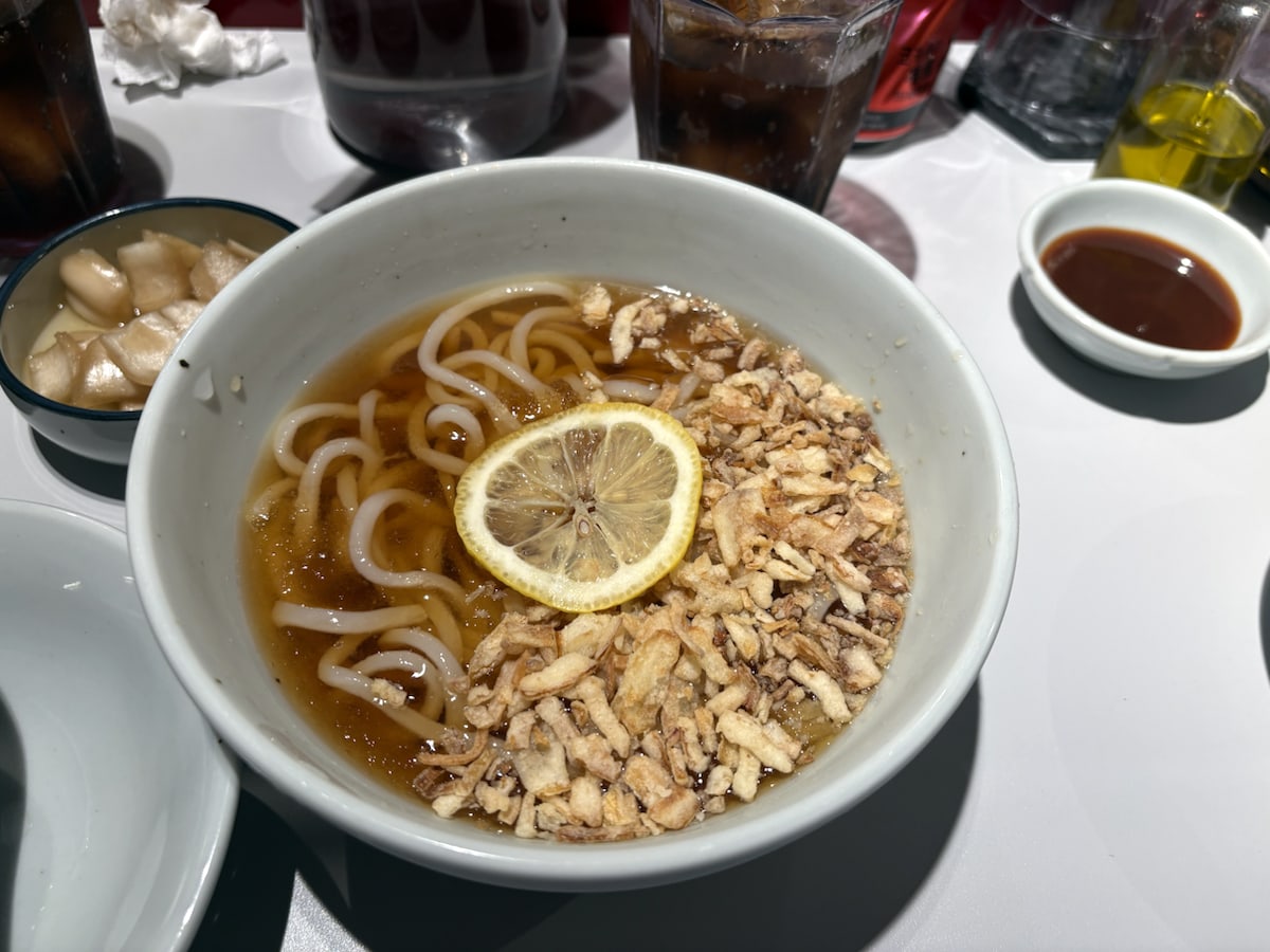 A bowl of lemon cold udon served with a katsu meal at Heki Mangwon